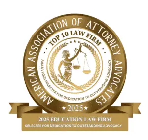 A gold emblem from the American Association of Attorney Advocates (AAAA) recognizing a law firm as a "Top 10 Law Firm" in 2025 for education law. The badge features Lady Justice holding scales, with a banner below that reads "2025 Education Law Firm – Selectee for Dedication to Outstanding Advocacy.