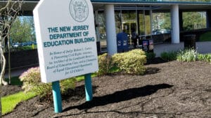 New Jersey Title IX lawyer resources and the Department of Education Building in Trenton, symbolizing school discipline and student rights oversight.